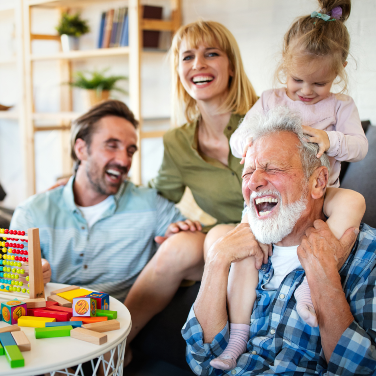 Family laughing together celebrating having life insurance